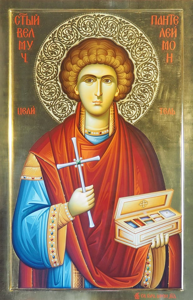 Gold-ground icon of the Great Martyr and Healer Panteleimon, holding the martyr's cross and the open medicine box of a physician.