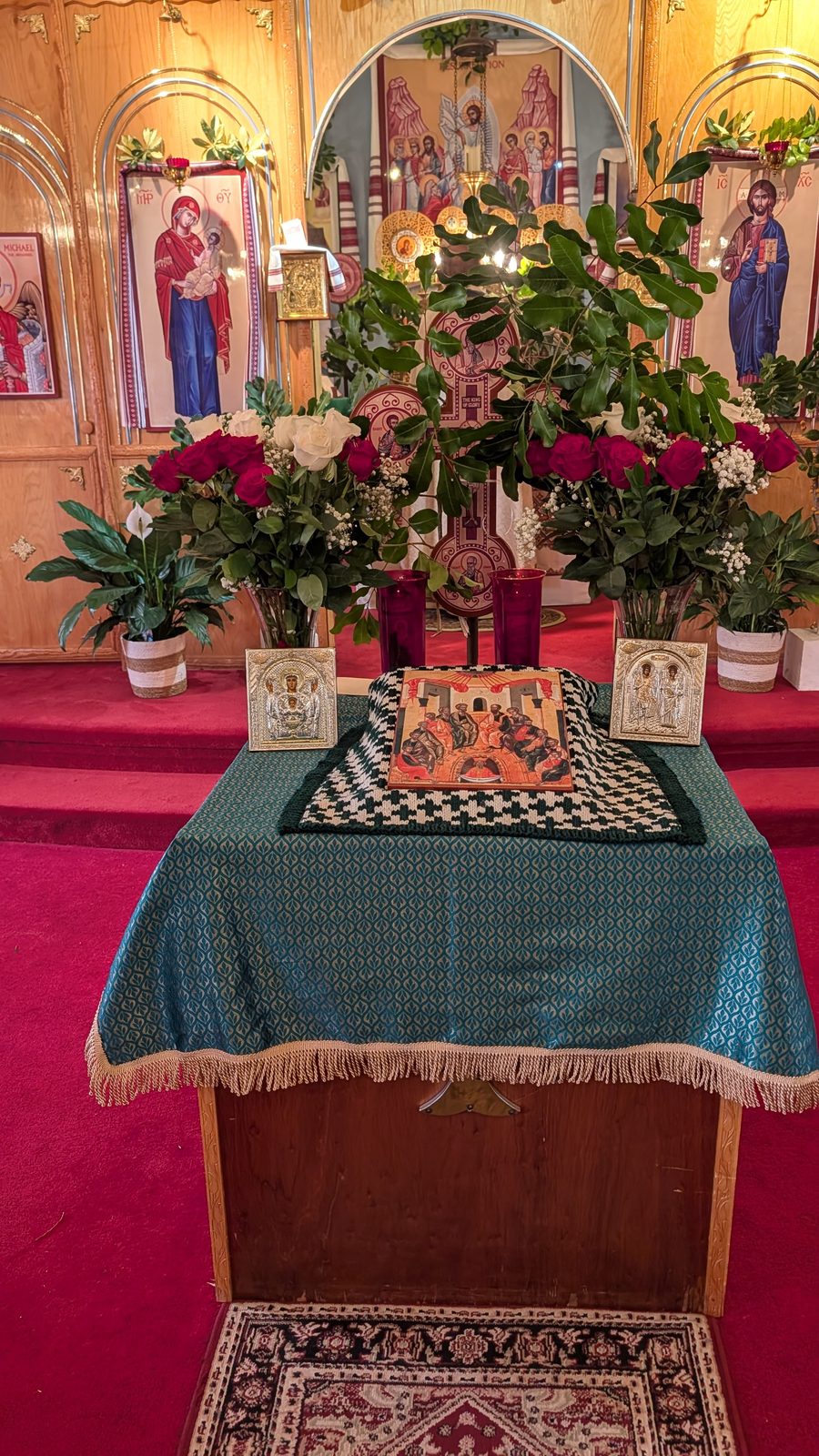 Tetrapod dressed in the red-and-white festal cloth with the Pentecost icon