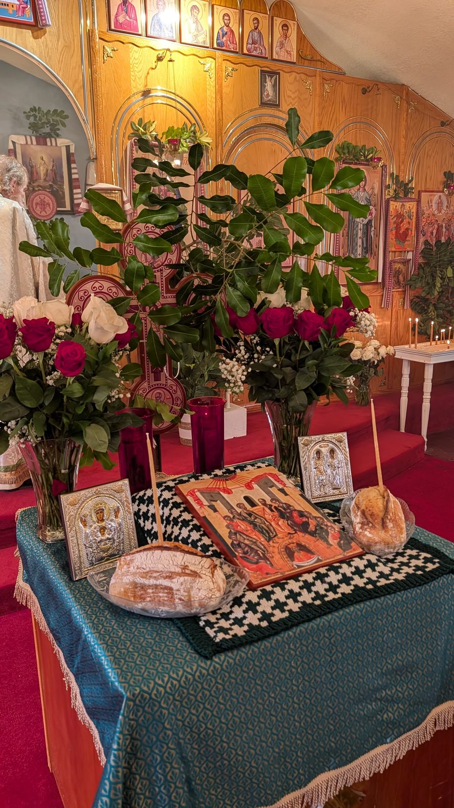 Tetrapod with prosphora and the festal icon; Fr. Stephen in gold vestments near the altar